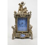 A French brass mantel clock with enamelled copper panels and dial, decorated with winged putti,