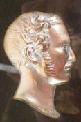 A C19th coppered profile bust of Prince Albert, 3" long, framed