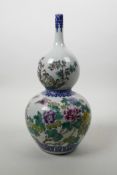 A Chinese polychrome porcelain double gourd vase with a slender neck decorated with birds and