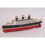 An early C20th Bing clockwork tin model of an ocean liner, Leviathan, 20" long, A/F