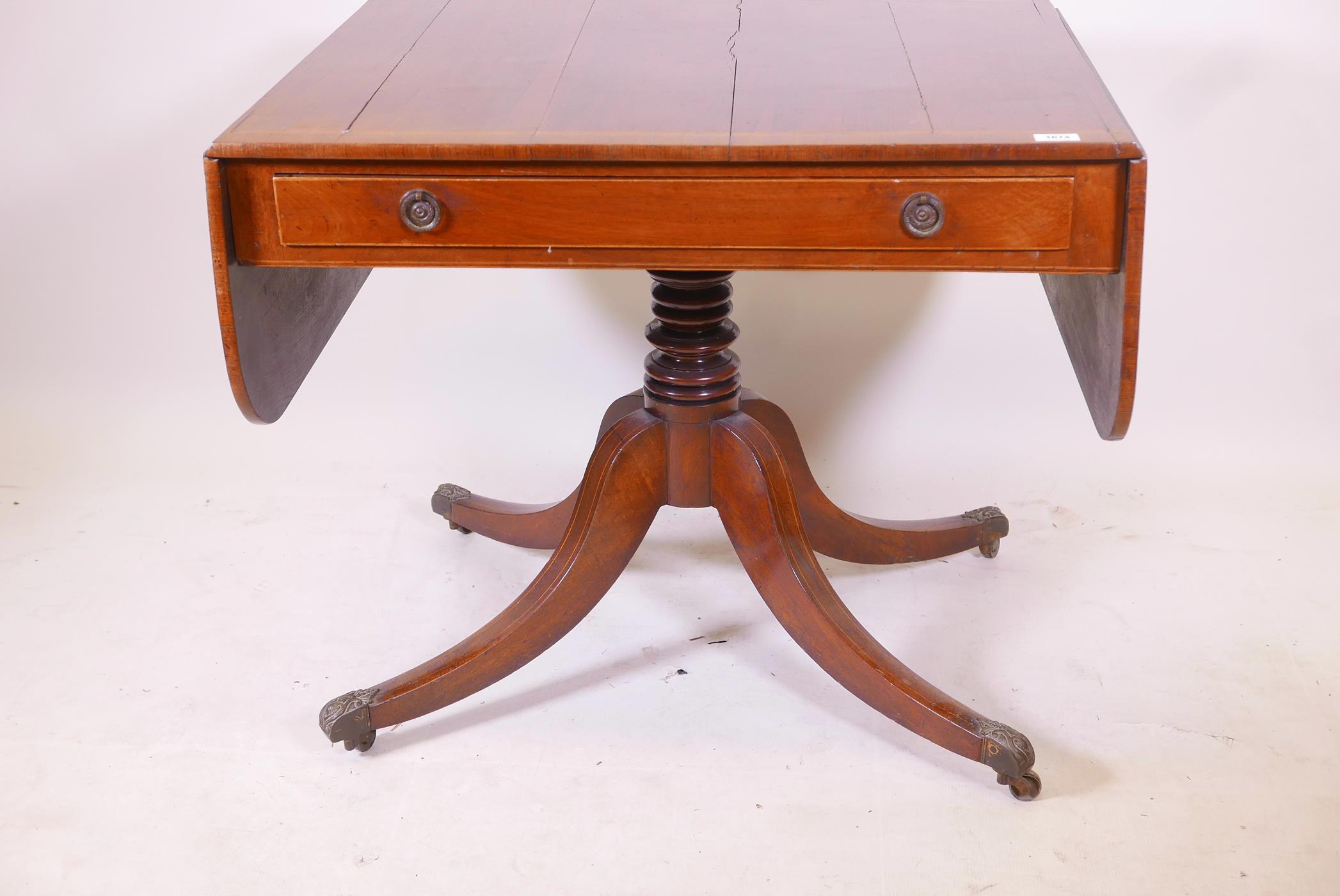 A Regency rosewood single drawer sofa table with satinwood banded top and boxwood stringing,