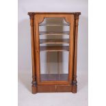 A Victorian inlaid walnut music cabinet, with single glazed door flanked by carved and reeded