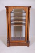 A Victorian inlaid walnut music cabinet, with single glazed door flanked by carved and reeded