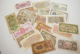 A quantity of replica Chinese banknotes of various denominations