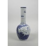 A Chinese blue and white porcelain bottle vase with raised decoration of a dragon chasing the