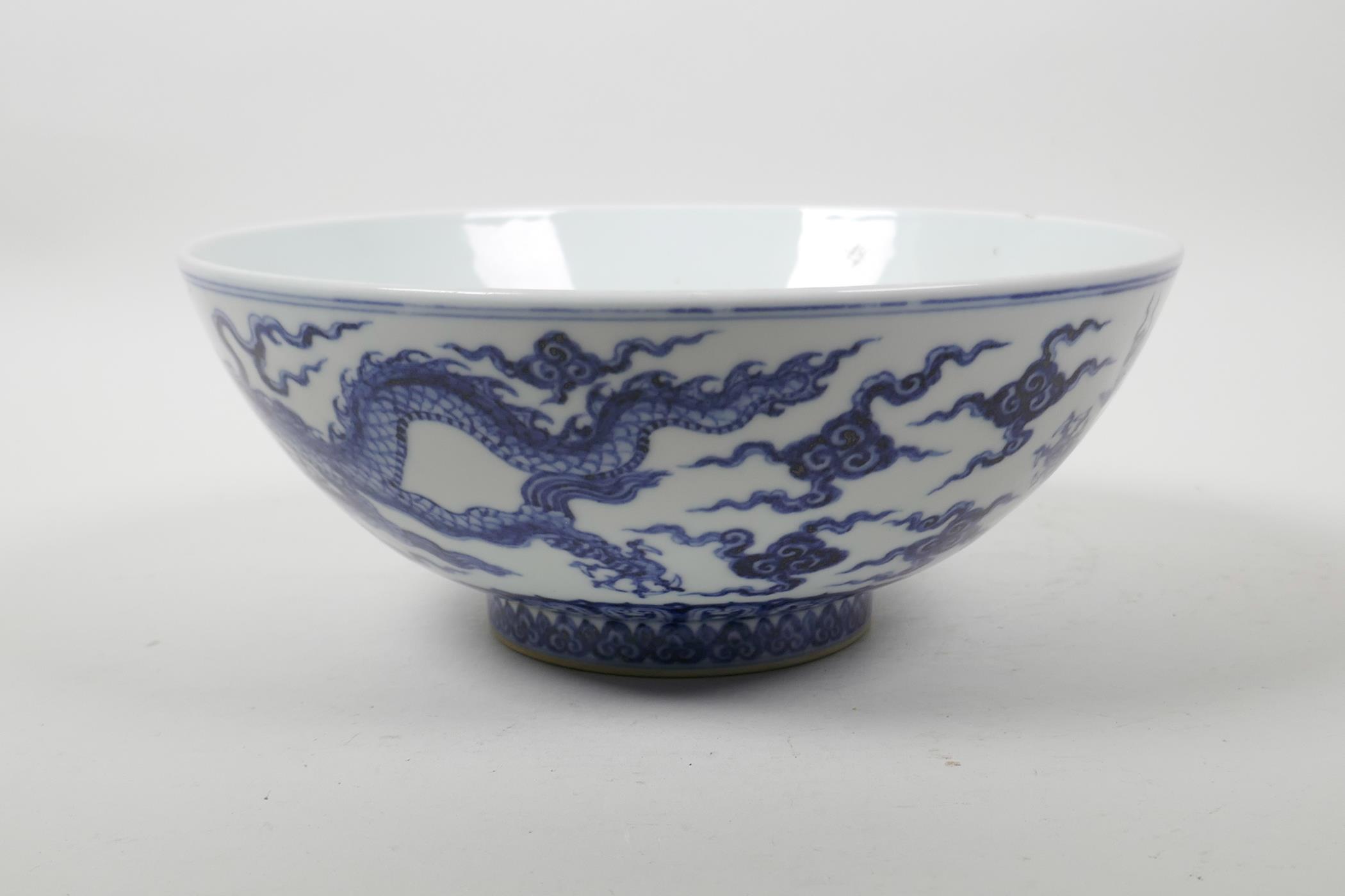 A Chinese blue and white porcelain bowl decorated with two dragons, 6 character mark to lip, 9" - Image 2 of 6