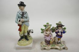 A C19th Staffordshire porcelain figure of a hunter with a gun and dog at his feet, 7" high x 3"