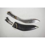 A Gurkha kukri in leather sheath, with two sharpeners and horn handles, 16½" long
