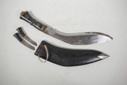 A Gurkha kukri in leather sheath, with two sharpeners and horn handles, 16½" long