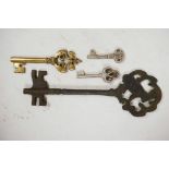 Four mixed metal keys, longest 11"