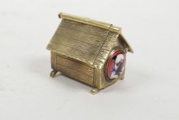 A brass vesta case in the form of a dog's kennel, 2" long