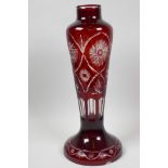 A Bohemian flash cut red over clear glass lamp base, 15" high