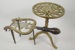 A C19th brass and iron fireside trivet in the shape of a lyre with turned fruitwood handle, 6" high,