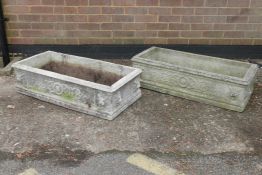 A pair of reconstituted stone garden troughs, with lion mask decoration, 37" x 17"