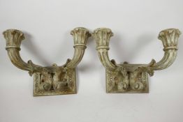 A pair of gilt carved wood two light candle wall sconces, 9" wide, worn