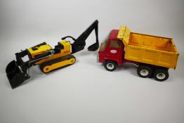A vintage Tonka toy tracked digger, 18" long, together with a vintage Tonka six wheel tipper