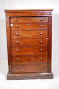 A C19th Wellington chest, fitted with a secretaire drawer, the interior fitted with drawers,