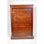 A C19th Wellington chest, fitted with a secretaire drawer, the interior fitted with drawers,