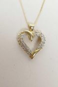 A 14ct yellow gold and diamond set, heart shaped pendant necklace, 1" drop