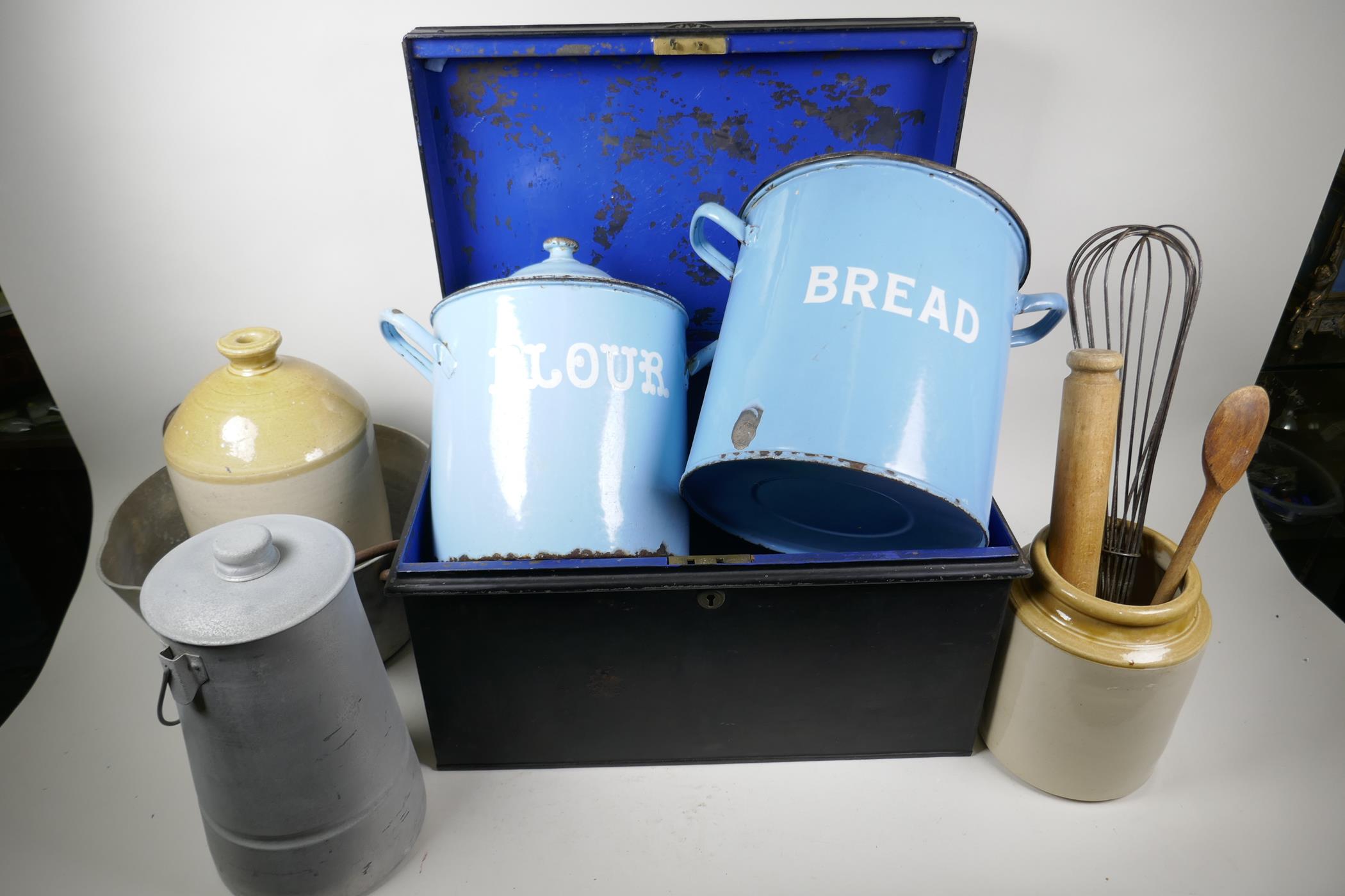A collection of enamelled kitchen bins, stoneware jars, maslin pan, deed box etc