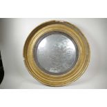 A Regency convex mirror in a heavy gilt frame, 27" diameter overall