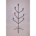 A wrought iron floor standing seven branch candelabra, 45" high