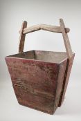 A Chinese antique red lacquered wood grain basket, 15½" x 15½", 22½" high