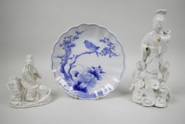 An C18th Chinese blue and white porcelain plate of a bird on a prunus with peonies hand painted in