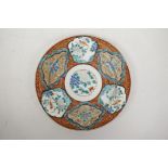 A Chinese porcelain cabinet plate with decorative panels depicting birds and flowers, 6 character