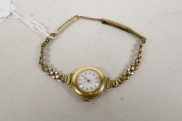 A lady's Art Deco 18ct gold wristwatch with 18 jewel Swiss movement and enamel dial with gold minute