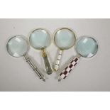 Four hand held magnifying glasses, 10½" long