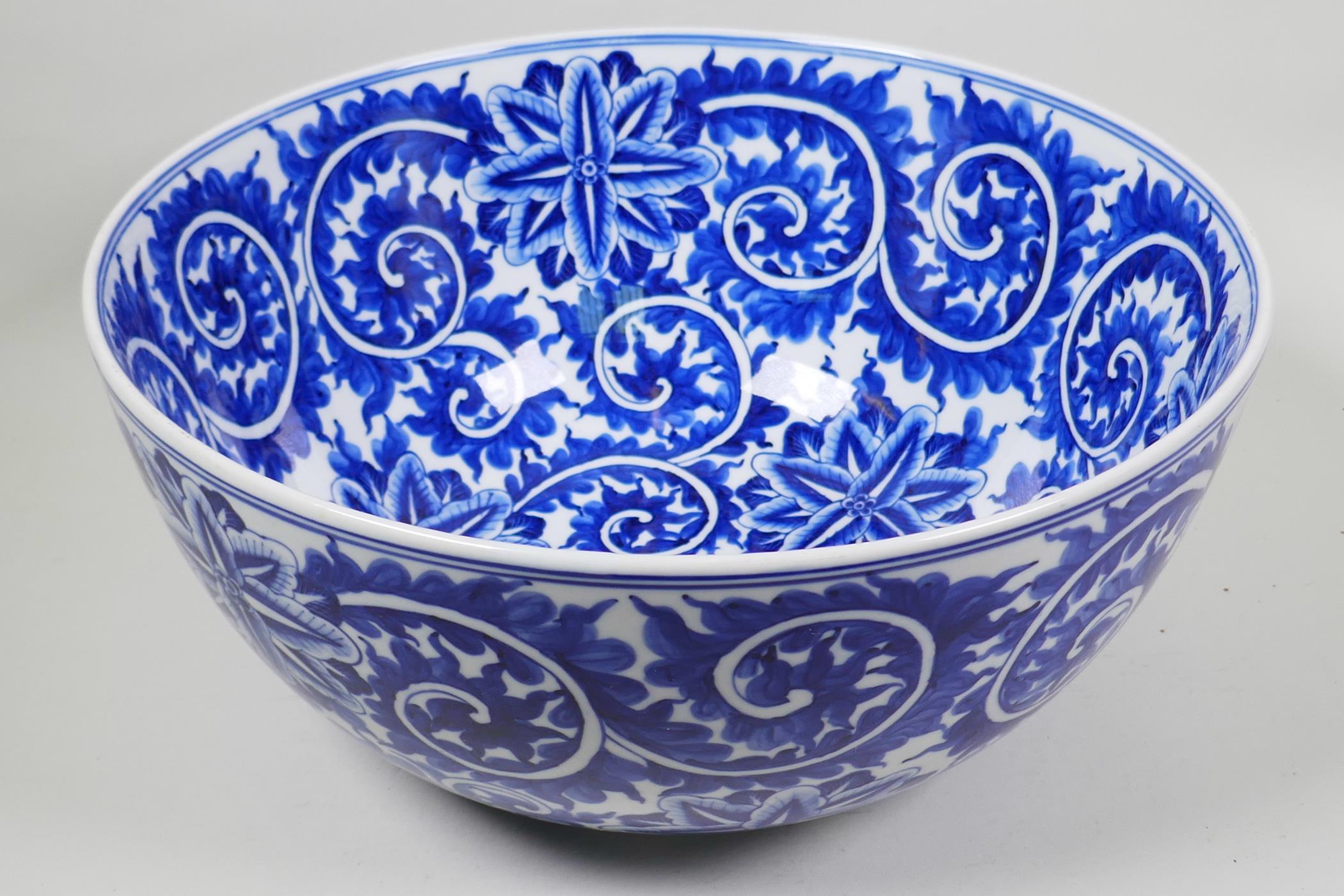 A large blue and white porcelain bowl with scrolling floral decoration, 14" diameter - Image 2 of 5