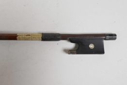 A French, silver mounted violin bow by and stamped 'A. Lamy A Paris', the stick round, the ebony