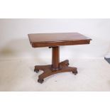 A Victorian mahogany reading table, the sliding top with two ratcheted slopes, raised on a shaped