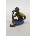 A cold painted bronze in the manner of Bergman, of a man smoking a pipe, 2½" high