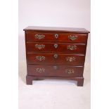 A late C18th/early C19th mahogany bachelor's style chest of four graduated long drawers and a cut