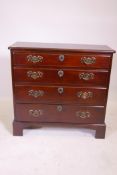 A late C18th/early C19th mahogany bachelor's style chest of four graduated long drawers and a cut