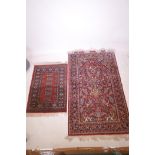Two Belgian red ground rugs decorated with Persian designs, largest 37" wide