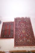 Two Belgian red ground rugs decorated with Persian designs, largest 37" wide