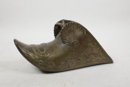 An Ottoman bronze stirrup with raised laurel decoration, 10½" long