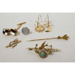 A mixed gold jewellery lot comprising a Victorian 15ct gold bar brooch of a swallow and floral