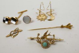 A mixed gold jewellery lot comprising a Victorian 15ct gold bar brooch of a swallow and floral