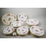 A large quantity of early C20th Royal Crown Derby 'Posies' porcelain part-dinner service, hand