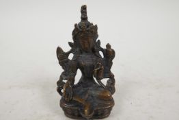 A Sino-Tibetan figure of a deity, double vajra mark to base, 3¼" tall