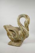An Indian carved, painted and distressed wooden swan, the wings inset with multicoloured mirrored