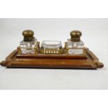 A C19th brass inlaid hardwood desk standish with two glass inkwells and nib tray, 13½" long x 6½"