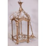 A gold painted wrought metal hall lantern, 33" long