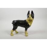 A cold painted cast iron dog, 8" high, 7" long