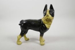 A cold painted cast iron dog, 8" high, 7" long