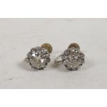 An exceptionally fine pair of old cut diamond earrings on 9ct gold mounts, the central diamond